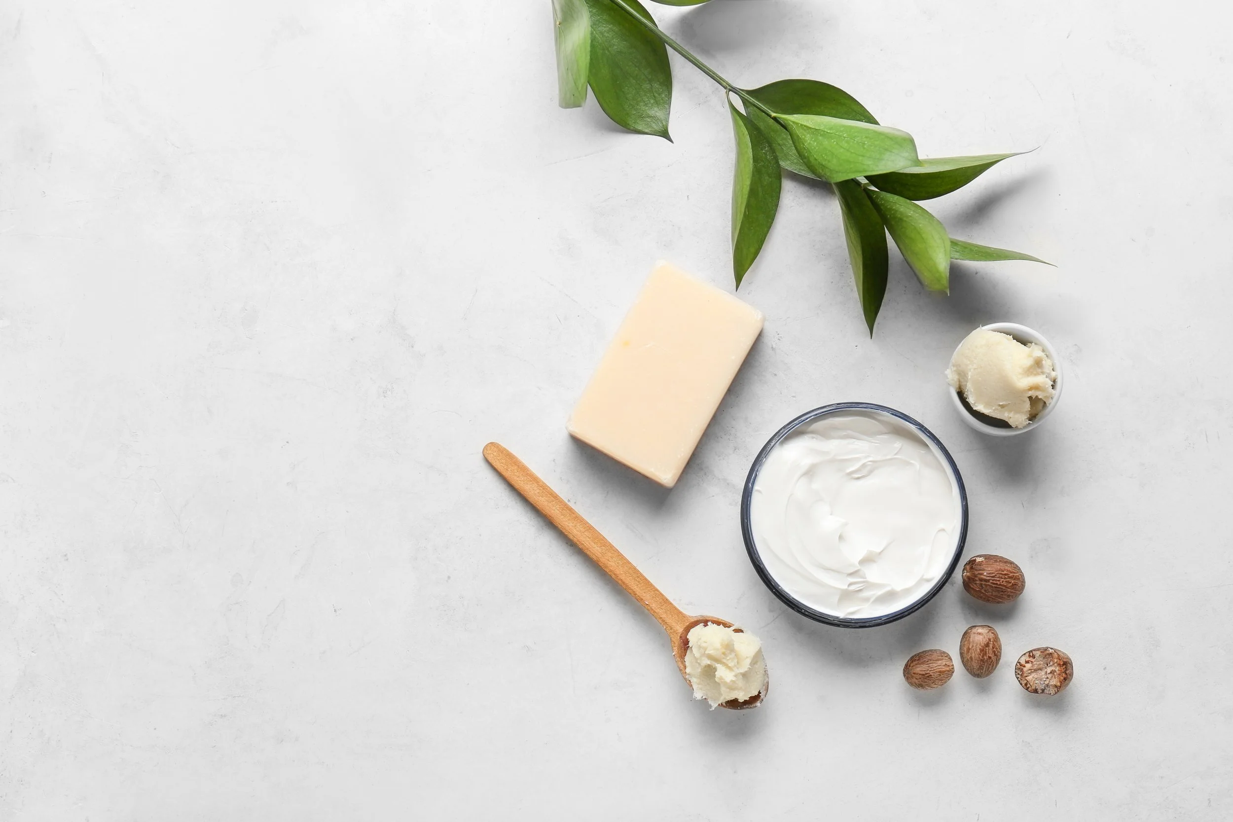 Natural skincare ingredients on a light surface